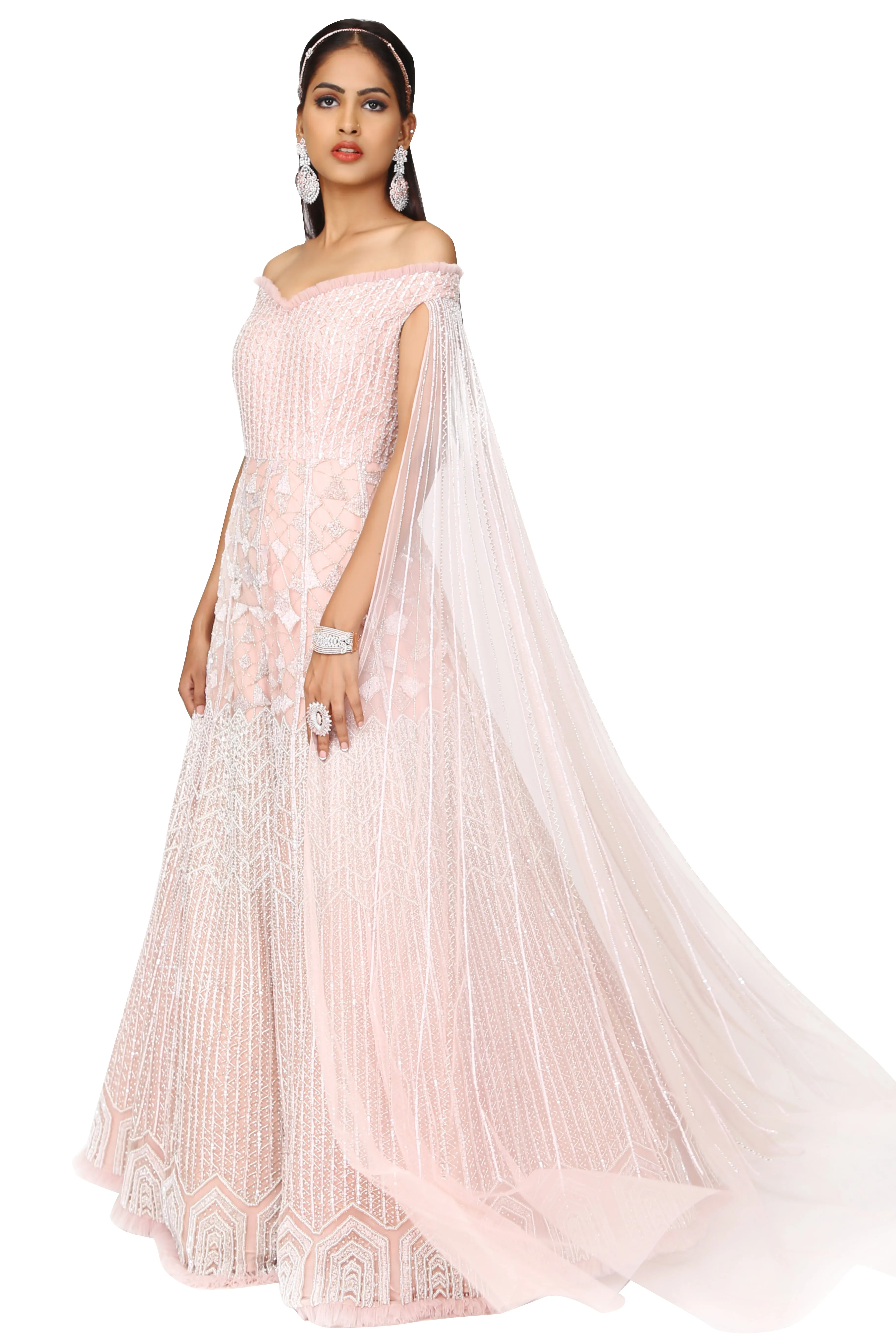 Off-shoulder gown with one side long sleeve.